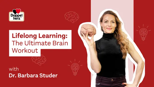 A woman holds a brain model while wearing a black top. The background features a red design with brain icons and lightbulbs, emphasizing the theme of lifelong learning and brain development. Text includes "Lifelong Learning: The Ultimate Brain Workout" and "with Dr. Barbara Studer."