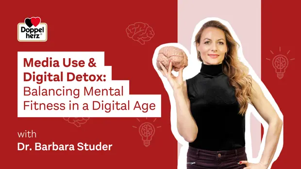 A woman holds a model of a human brain while standing against a vibrant background. The text highlights a discussion titled "Media Use & Digital Detox: Balancing Mental Fitness in a Digital Age," featuring Dr. Barbara Studer.